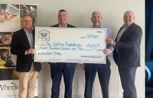 Todd holding check